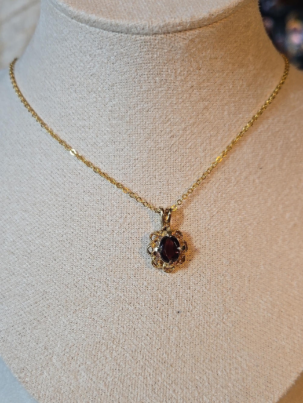 Gold Floral Pendant Necklace with Deep Red Gem